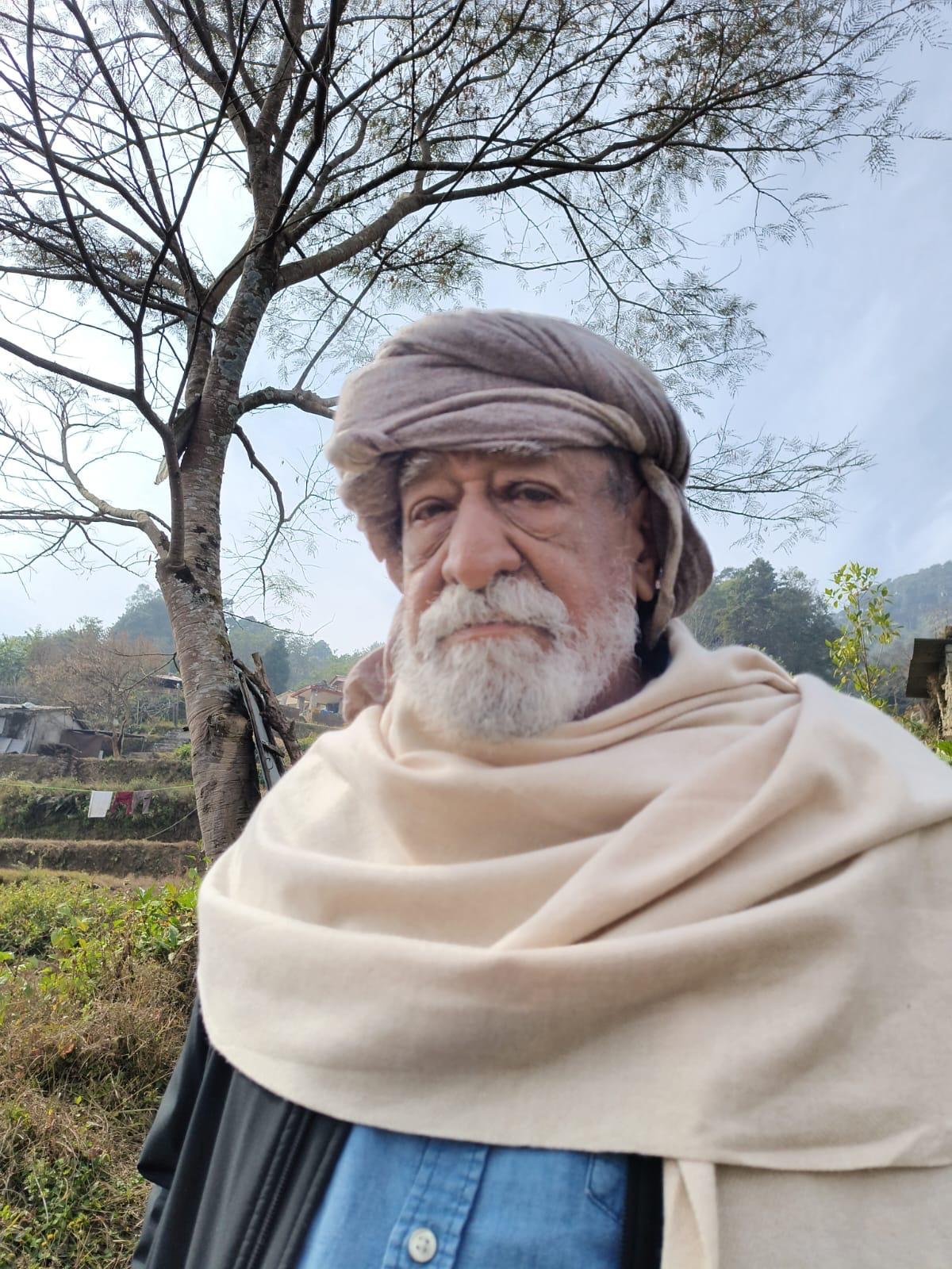 Nivedano at Osho Kakani standing outdoors with hills in the background